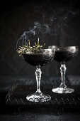 Blackberry, vodka and smoking rosemary Martinis
