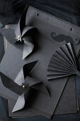 Windmills and fan made from black paper