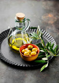 Olives, olive oil and an olive sprig