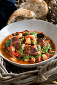 Butter bean stew with chorizo and spinach pesto
