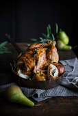 Roast chicken with sage, apple and pear