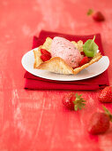 Strawberry and basil mousse with an almond wafer