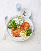 Low-calorie Viennese escalope with cucumber salad
