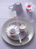 Easter place setting with cappuccino, flowers and Easter egg