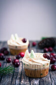 A winter apple and cranberry cupcake with cider and frosting