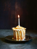 Lemon meringue cake with burning candle