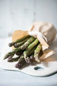 Green asparagus in a paper bag