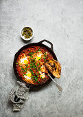 Shakshuka (poached eggs, North Africa) with harissa sauce