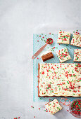 Spice cake tray bake with buttercream and sugar sprinkles