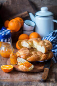 Homemade orange wreath bread with marmalade