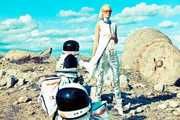 Futuristic Fashion: a blonde woman outside with children in astronaut costumes