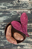 Purple sweet potatoes, whole and halved