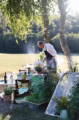 Man wearing apron cooking on barbecue