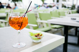 Aperol Spritz cocktail served in an open bar