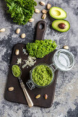 A jar of green kale pesto