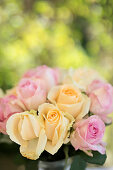 Bouquet of summery roses on table