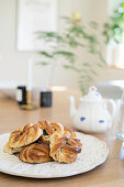 Poppy seed pastries on white plate