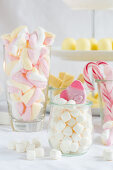 Two jars of marshmallows and a gummy pig sweet