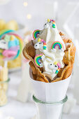 A bubble waffles with frozen yoghurt decoration with rainbows and unicorns