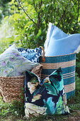 Cushions in woven bags in garden
