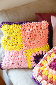 Cushions made from crocheted jersey granny squares in pink and yellow