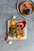 Crudo salad with beetroot and baby clementines