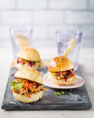 Apple-and-pear pulled pork sliders with cider sauce