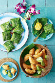 Beef curry puffs and Spicy fish cakes in banana leaves