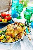 Herb-stuffed chicken with crushed potatoes