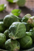 Fresh Brussels sprouts in a small bowl (close up)