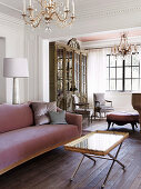 Elegant sofa and tray table with a golden edge in the background antique, French display cabinet and armchair