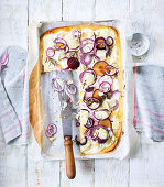 Tarte flambée with goat's cheese and plums
