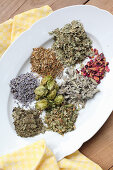 Ingredients for a soothing pillow of hops, dried roses and herbs