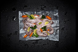 Octopus with lemons and herbs in a sous vide bag