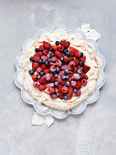 Pavlova with cream and berries for Christmas
