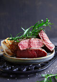 Grilled beef steaks with fresh tarragon
