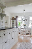 View from kitchen into dining room in Scandinavian country-house style