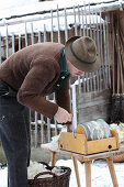 A man working on clean wool fibers