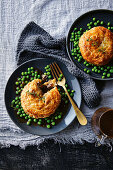 Pithiviers (puff pastry pies) with duck meat and peas