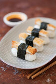 Nigiri sushi with crispy chicken strips