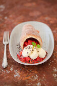 Strawberry and rhubarb compote in a doughnut cone