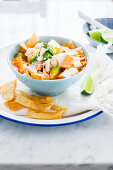 A bowl with mexican chicken tortilla soup