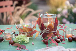 Mason Jars With Autumn Leaves Decorated As Lanterns