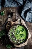 Spinach smoothie with coconut milk, chocolate and coconut shrims