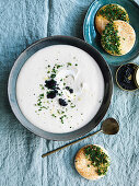 Roast garlic and potato soup with caviar and herb toast