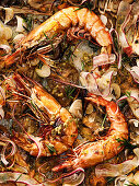 Oven-baked tiger prawns with radish, rosemary and passion fruit