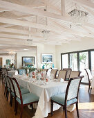 Festively set table and upholstered chairs