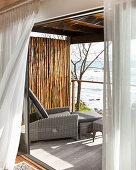 Lounger on balcony with sea view