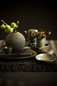 Autumnal arrangement with green figs on set table