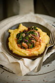 Polenta with beetroot leaves and bacon